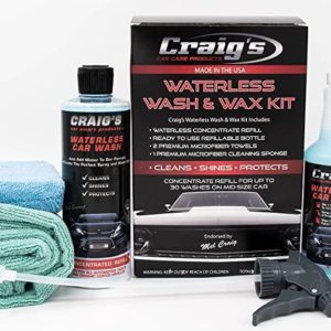 A complete car care kit, including a large black and red labeled box of Craig’s Waterless Wash & Wax Alternative for Drought, a blue microfiber towel, a green microfiber towel, a white spray nozzle, and a bottle of Craig's concentrated refill solution with a matching label—a perfect wax alternative ideal for drought conditions.