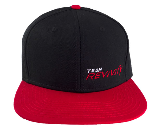 A black and red Snap Back Cap featuring the text "TEAM REVivify" embroidered in white and red on the front. The cap's crown is black, while the bill is red with coordinating stitching, complemented by a stylish red top button.