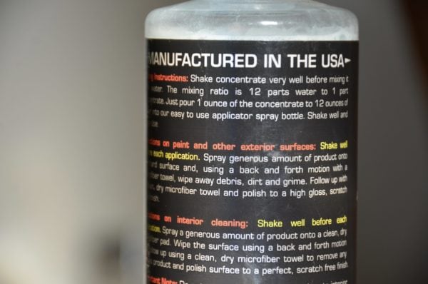 Close-up of the Craig's Waterless Wash & Wax 16oz refill bottle label. The text includes instructions for use, mixing ratios, and describes how to perform a waterless wash. The header reads "MANUFACTURED IN THE USA," with sections dedicated to applications on paint, exterior surfaces, and interior cleaning.