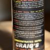 Close-up of a product label on a 16oz refill bottle of "Craig's Waterless Wash & Wax" from Craig's Car Smart Products. The text details application instructions, health hazards (H316), and contact information, with an emphasis on keeping it out of reach of children.