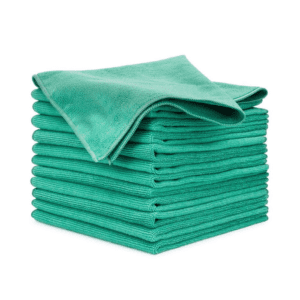 A neatly stacked pile of ten green microfiber cleaning cloths, with one cloth partially unfolded and draped on top. The cloths have a soft, textured surface suitable for dusting, cleaning, and polishing.