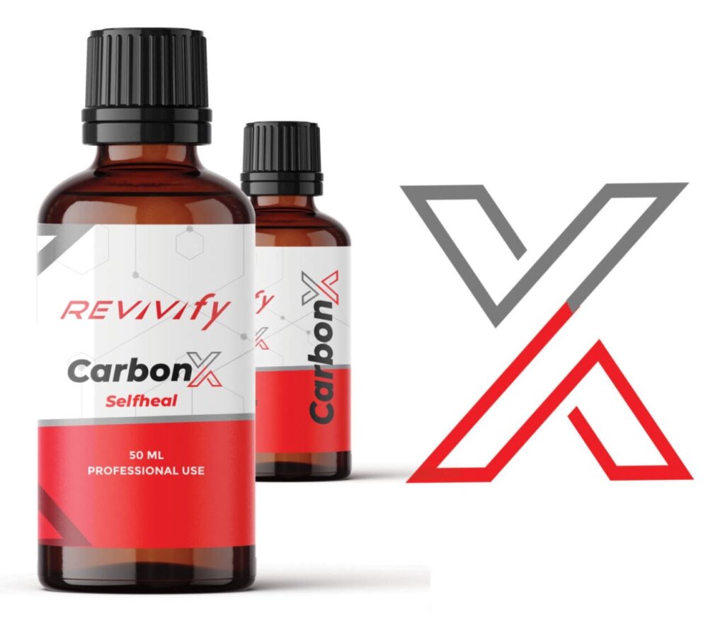 Two bottles of Revvify CarbonX Selfheal, each containing 50 mL for professional use. The brown bottles feature black caps and red labels, prominently displaying the large "X" logo that signifies Revivify Coatings branding. Set against a crisp white background, these products stand out unmistakably.